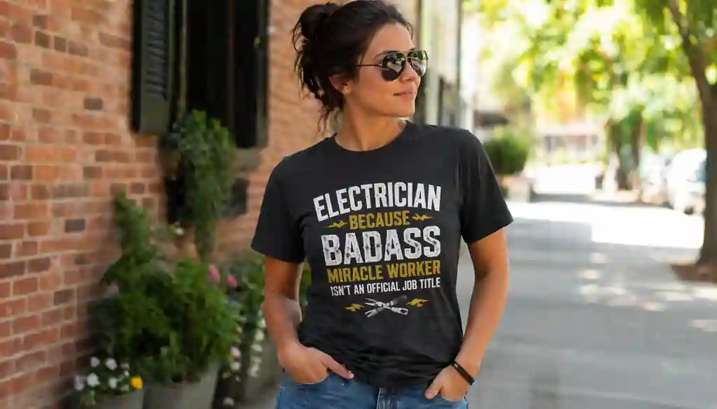 woman wearing electrician graphic shirt in casual outdoor setting