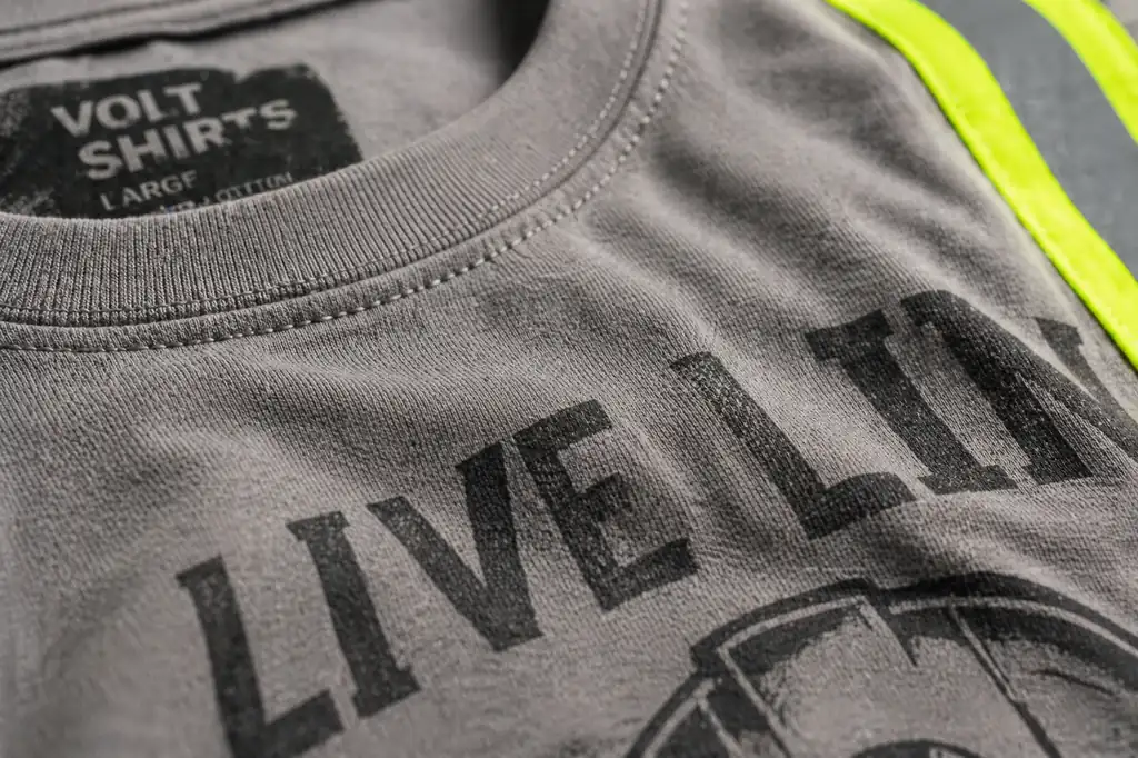 close up of industrial safety shirt print and cotton fabric texture